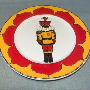 Kate Williams Nutcracker Christmas plate. 8-9 inches.  Used Some chips